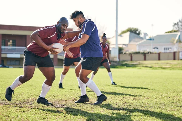 Rugby, sports and rival with a team on a field together for a game or match in preparation of a competition. Fitness, health and teamwork with a male athlete group training on grass for practice.