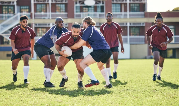 Rugby, fitness and tackle with a team on a field together for a game or match in preparation of a competition. Sports, training and teamwork with a group of men outdoor on grass for club practice.