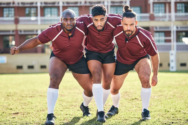 Portrait, fitness and a rugby team training together for a scrum in preparation of a game or competition. Sports, exercise and teamwork with a male athlete group at an outdoor stadium for practice.