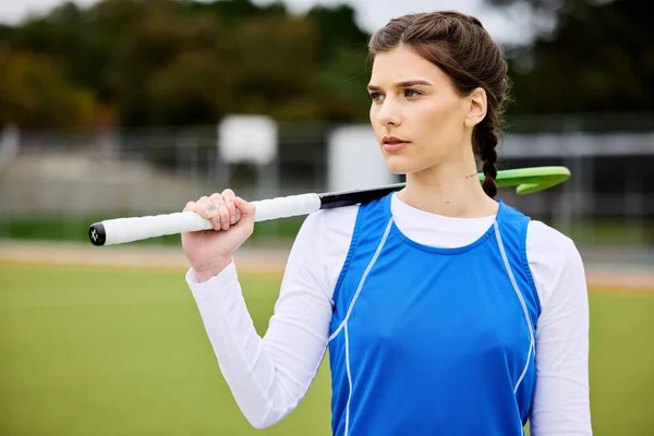 Field hockey woman, thinking and sport with vision, ideas and goals for career, competition and stick for game. Girl, athlete and outdoor for training, workout or exercise with strategy for contest.