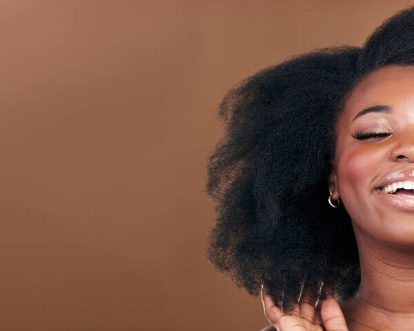 Mockup, closeup and black woman with hair care, smile or cosmetics on a brown studio background. Half, African model or person with aesthetic, salon treatment for afro or wellness with natural beauty.