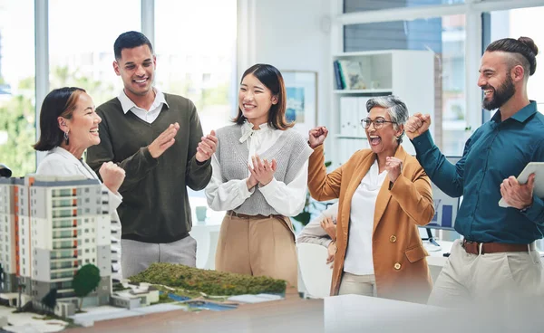 Business, staff and architecture with achievement, celebration and applause for success, growth and real estate development. Excited group, men and women cheering, property and engineer with model.