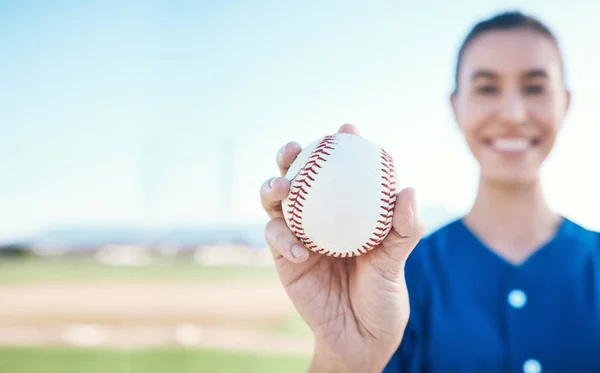 Hand, ball and baseball with a woman on mockup for sports competition or fitness outdoor during summer. Exercise, training and softball with a sporty female athlete on a pitch for playing a game.