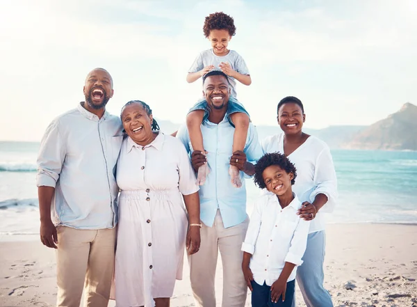 Travel, smile and portrait of black family at beach for happy, summer break and bonding on vacation. Relax, holiday trip and generations with parents and children for quality time, sunshine and fun.