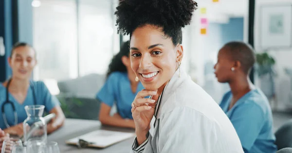 Woman, face or doctor in teamwork meeting, medical leadership or life insurance planning in hospital boardroom. Smile, worker or healthcare portrait in diversity, collaboration or clinic presentation.