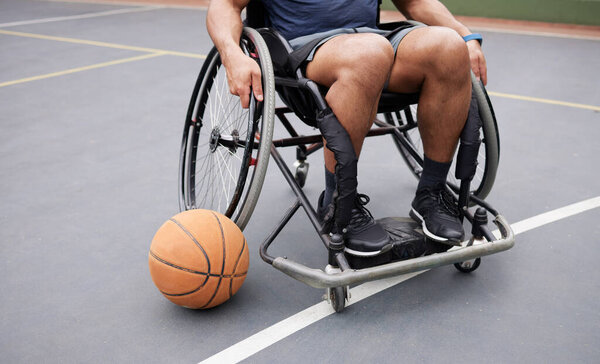 Wheelchair, sports and man with basketball at outdoor court for fitness, training and cardio. Exercise, closeup and person with disability at a park for game, workout and weekend fun or active match.