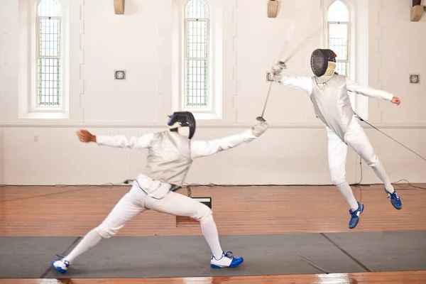 Sport, fencing and men with sword to fight in training, exercise or workout in a hall. Martial arts, match and fencers or people with mask and costume for fitness, competition or target in battle.