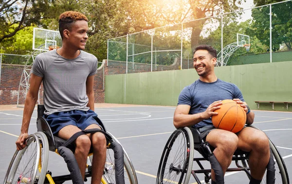 Basketball player, men and team in wheelchair for sports break, rest and fitness on training court. People with a disability, athletes and happy with ball, mobility equipment and exercise workout.