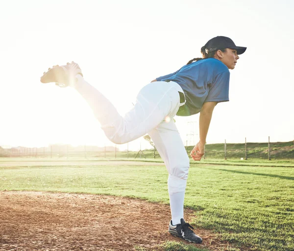 Baseball, pitching and sports person outdoor on a pitch for performance and competition. Professional athlete or softball player for a game, training or exercise challenge at field or stadium.