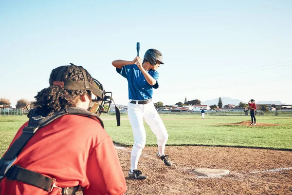 Bat, baseball and person swing at ball outdoor on a pitch for sports, performance and competition. Behind athlete or softball team ready for a game, training or exercise challenge at field or stadium.