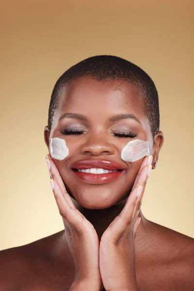 Skincare, smile and black woman with face cream in studio for makeup removal and wellness on brown background. Facial, cleaning and African model with moisturizer, exfoliate or beauty skin scrub.
