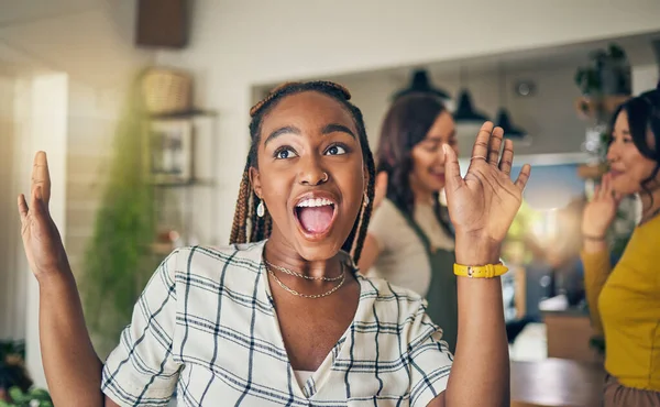 Friends, excited and black woman in home dance for relaxing, having fun and bonding together. Relax, happy and group of people in living room listening to music, audio and song for freedom and energy.