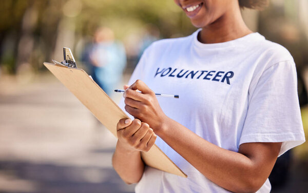 Woman, checklist and volunteering in park for climate change, outdoor inspection or community service. Happy person writing on clipboard for earth day, NGO registration or nonprofit sign up in nature.