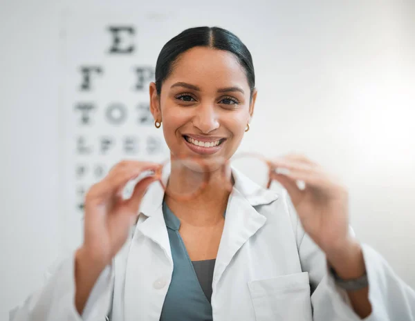 Doctor, woman and glasses, vision and eye care, portrait and optometry with health and smile. Prescription lens, frame choice and healthcare, eyewear and optometrist with wellness and medical service.