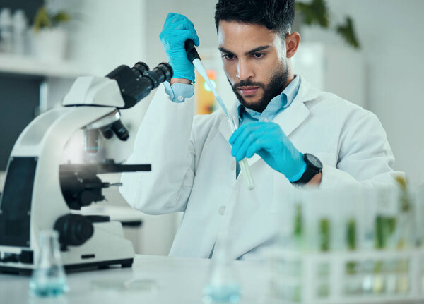 Science, results and man with test tube in laboratory, research and medical engineering at microscope. Biotechnology, pharmaceutical and study, scientist or lab technician checking solution in glass