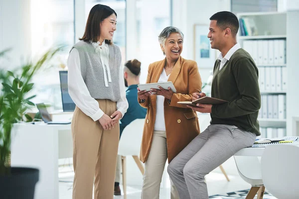 Teamwork, happy or funny business people in meeting laughing at joke in discussion with paperwork. Collaboration, leadership or excited mature mentor talking or speaking of ideas or plan to employees.