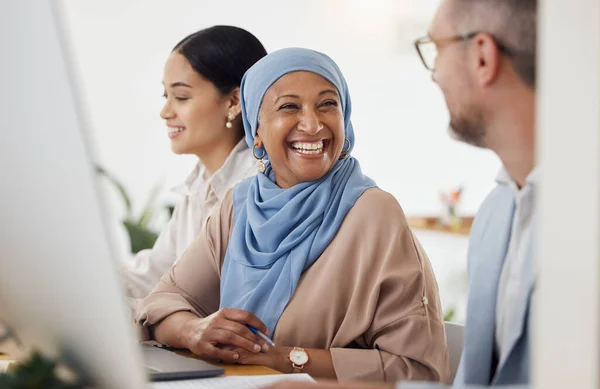 Happy, teamwork and business people in office for training, advice and collaboration while working on a computer. Smile, laugh and Muslim senior woman mentor laugh with work friend while planning.