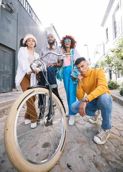Friends group, bicycle and portrait outdoor for travel, fashion style and fun with young people in city. Diversity, gen z and men and women with cool attitude on student adventure on urban street.