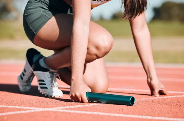 stock image Start, running and relay with hands of person on race track with baton for sports, competition and marathon. Exercise, health and wellness with closeup of runner in stadium for challenge and athlete.