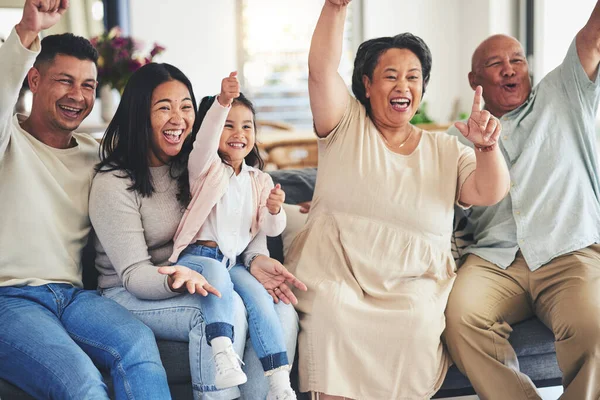 Happy family, child or grandparents in celebration for sports in home living room watching tv together. Grandfather, score or excited mother cheering with dad, kid fan or grandmother for goal success.