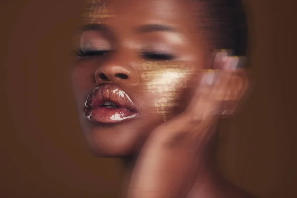 Black woman, face and gold makeup closeup with luxury dermatology and  skincare mask with glitter. Sparkle, smile and beauty with rich and shine  of cosmetics and model in a studio with facial