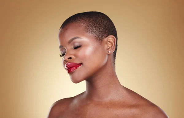 Mockup, makeup and black woman with cosmetics, shine and dermatology on a brown studio background. Glow, person and model with skincare, wellness and spa promotion with aesthetic, luxury and beauty.
