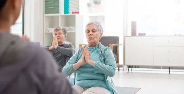 Old people in yoga class, fitness and meditation with breathing, wellness and retirement. Health, exercise and stretching, women and workout with elderly care and zen, mindfulness and vitality.
