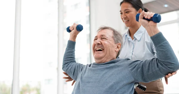 Physical therapy, senior patient with dumbbells and chiropractor with weightlifting, monitor progress and exercise. Help, support with old man and woman at clinic, muscle and health with physio.