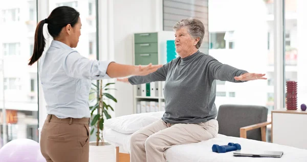 Physical therapy, senior patient and chiropractor, stretching and motion with exercise and progress in consultation. Help, support and women at clinic, elderly care and fitness with health and physio.