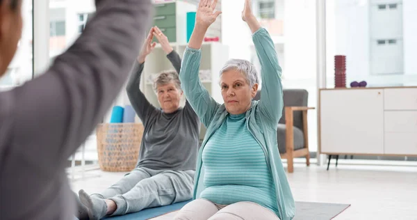 Old people in yoga class, fitness and meditation with breathing, wellness and retirement. Health, exercise and stretching, women and workout with elderly care and zen, mindfulness and vitality.