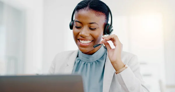 Black woman, call center and consulting on laptop for telemarketing, customer service or desktop support. Friendly African female consultant talking on headset for help, advice or communication.