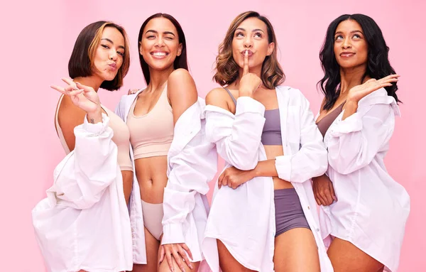 Beauty, cosmetics and women happy on pink background for wellness, skincare and body positivity. Friends, diversity and people with hand sign in studio for natural glamour, healthy skin and self love.