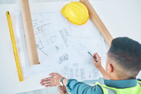 Blueprint, top view architect and planning man, engineer or developer reading floor plan of property design. Architecture, contractor inspection or engineering analysis of infrastructure illustration.