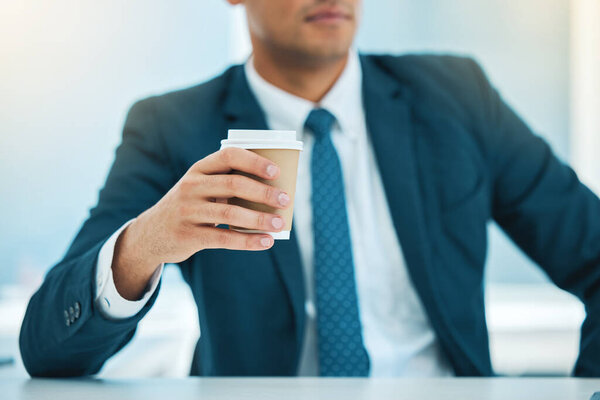 Hand, coffee and a business man in his office for morning caffeine in a cup to start his work day. Corporate, drink and takeaway beverage with a professional employee at a desk in the workplace.