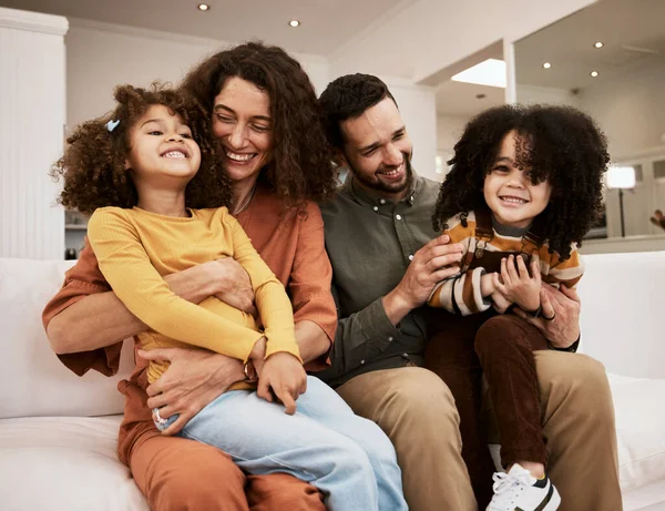 Happy parents, laugh and family child, mother and father excited, having fun and enjoy funny quality time together. Comedy humour, home and relax mom, dad or people playing with kids on lounge couch.