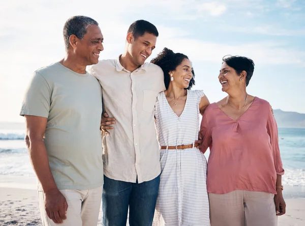 Ocean, senior parents and adult children together with smile, love and hug on summer holiday in Mexico. Embrace, happy family support and mature mom, dad and couple on beach vacation travel in nature.