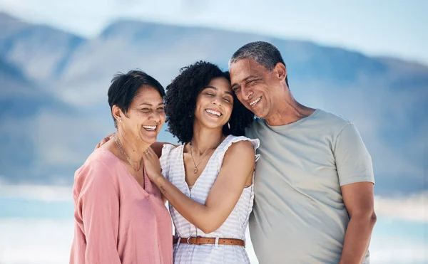 Beach, senior parents and adult daughter together with smile, love and hug on summer holiday in Mexico. Embrace, happy family support and mature mom, dad and woman on ocean holiday travel in nature