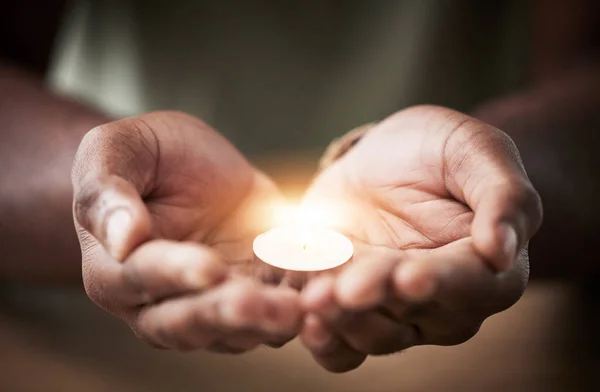 Prayer, candle or hands of man for worship, faith and belief for support, help and hope in Christian religion. Light, closeup or person in meditation for spiritual healing, mercy or trust for praise.