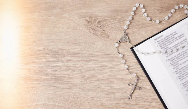 Rosary, table or bible study for faith, studying religion and mindfulness with holy spiritual scripture. Christian literature, background or story for education or knowledge on God or Jesus Christ.