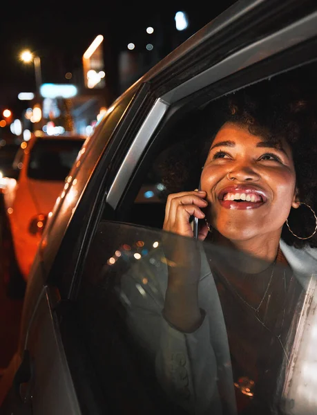 Black woman, phone call and travel at night in city taxi for communication, conversation or networking. Happy African female person smile, talking or late evening on mobile smartphone in discussion.