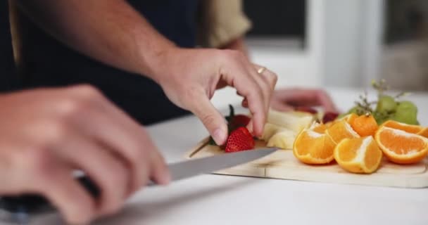 Man Feeding Woman Eating Fruit While Cooking Kitchen Conversation Bonding — Stock Video