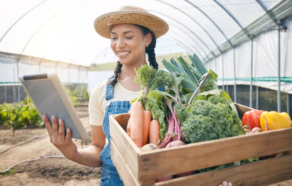 Farmer, tablet and vegetables box for agriculture, sustainability and farming in greenhouse or agro business. Person on digital technology, harvest and gardening e commerce inventory and market sales.