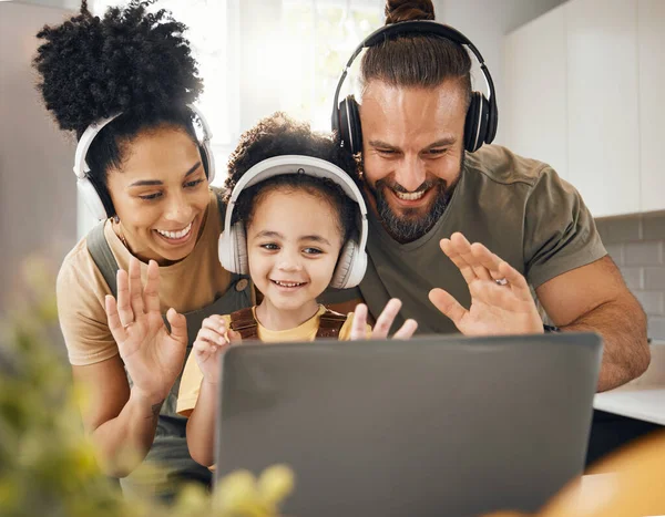 Laptop, headphones and parents with child on video call and wave hello, communication and people at home. Happy family, conversation and smile with app, network and connectivity, bonding and contact.