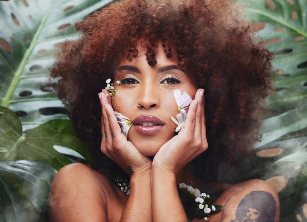 Flowers, beauty and portrait of black woman with skincare, cosmetics and creative or eco friendly art in nature or forest. Natural, face and model with flower makeup and healthy or organic skin care.
