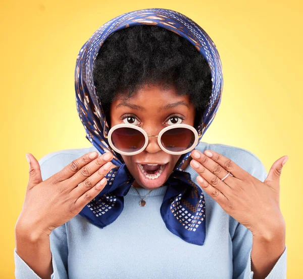 Surprise, portrait or black woman in sunglasses for a fashion promotion, sale deal or discount offer. Wow, African female model shocked by secret gossip or retail announcement on studio background.