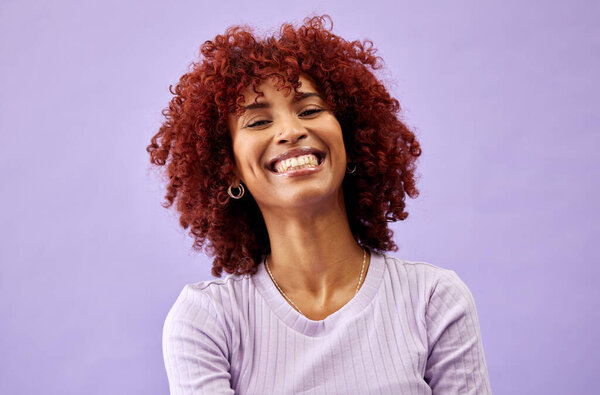 Natural, African beauty and portrait of woman in fashion with confidence, pride and smile on purple background in studio. Happy, face and collagen cosmetics for afro or dermatology skincare in salon.