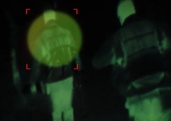 Military, enemy and target in night vision, overlay or dark green silhouette of spy, agent or terrorist risk to soldier. Police, surveillance and people in infrared security scope for army mission.