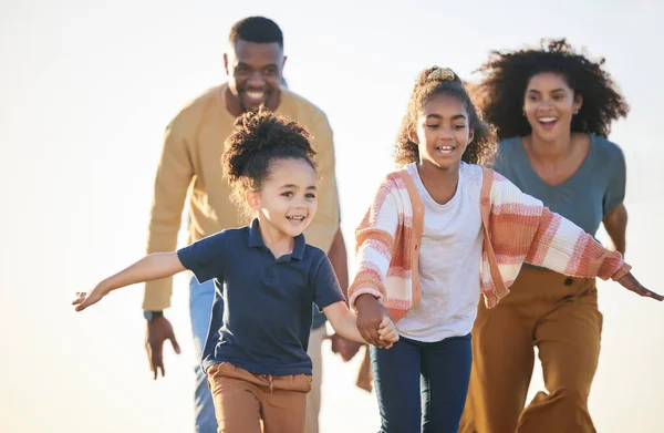 Nature freedom, sky and happy family running, fun race and play games, chase children and connect. Siblings, speed and fast kids holding hands, energy and bonding mother, father or parents together.