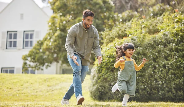 Happy, family running and garden of new home with love, support and fun with dad and kid. Backyard, smile and moving of game, father and young girl together with bonding outdoor and real estate.