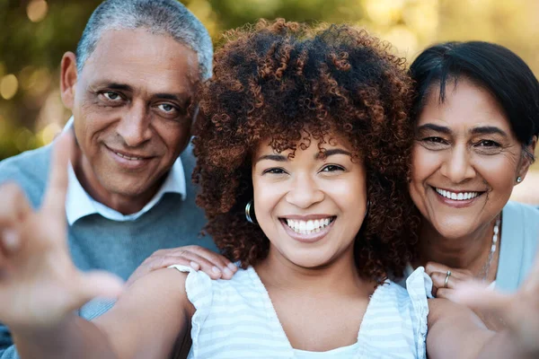 Selfie, portrait and woman with senior parents in an outdoor park for adventure, holiday or weekend trip. Happy, smile and young female person taking picture with her elderly mom and dad from Mexico